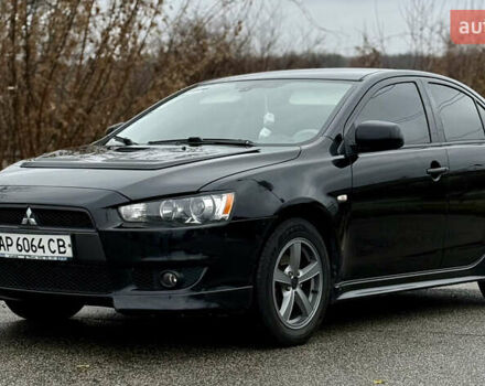 Черный Мицубиси Лансер, объемом двигателя 2 л и пробегом 215 тыс. км за 5500 $, фото 1 на Automoto.ua