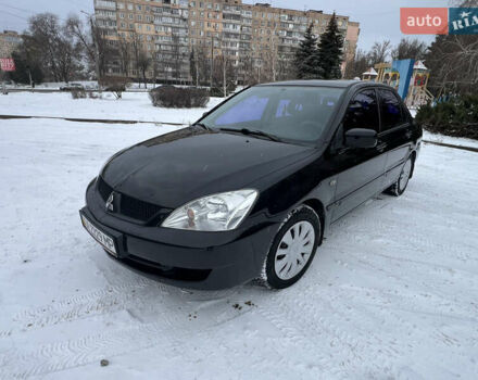 Чорний Міцубісі Lancer, об'ємом двигуна 1.58 л та пробігом 257 тис. км за 3800 $, фото 1 на Automoto.ua