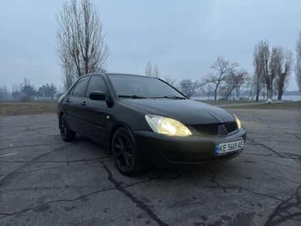Мицубиси Лансер 2007 в Каменское - Днепродзержинск на Automoto.ua Черный Мицубиси Лансер, объемом двигателя 1.6 л и пробегом 260 тыс. км за 4500 $, фото 1 на Automoto.ua