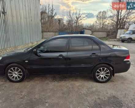 Черный Мицубиси Лансер, объемом двигателя 1.6 л и пробегом 239 тыс. км за 4200 $, фото 1 на Automoto.ua