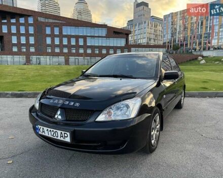 Чорний Міцубісі Lancer, об'ємом двигуна 1.58 л та пробігом 237 тис. км за 3999 $, фото 1 на Automoto.ua
