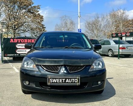 Черный Мицубиси Лансер, объемом двигателя 1.6 л и пробегом 226 тыс. км за 3899 $, фото 1 на Automoto.ua