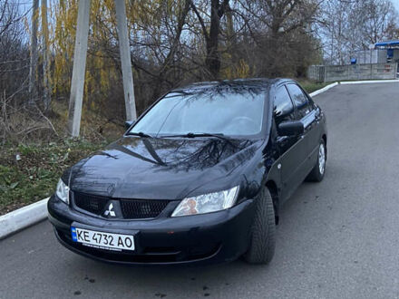 Черный Мицубиси Лансер, объемом двигателя 1.58 л и пробегом 213 тыс. км за 4900 $, фото 1 на Automoto.ua
