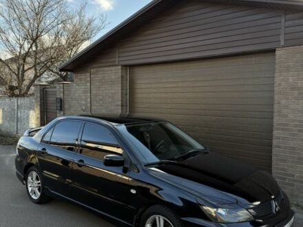 Чорний Міцубісі Lancer, об'ємом двигуна 2 л та пробігом 220 тис. км за 5250 $, фото 1 на Automoto.ua