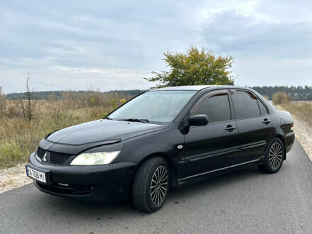 Чорний Міцубісі Lancer, об'ємом двигуна 1.6 л та пробігом 212 тис. км за 4700 $, фото 1 на Automoto.ua