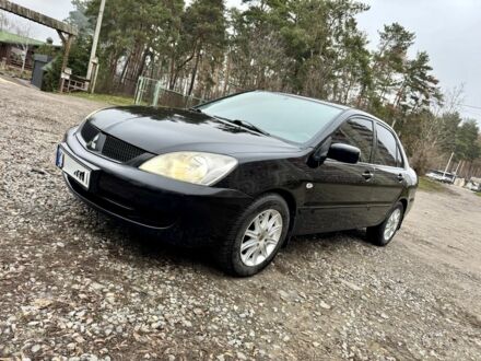 Чорний Міцубісі Lancer, об'ємом двигуна 1.6 л та пробігом 216 тис. км за 4990 $, фото 1 на Automoto.ua