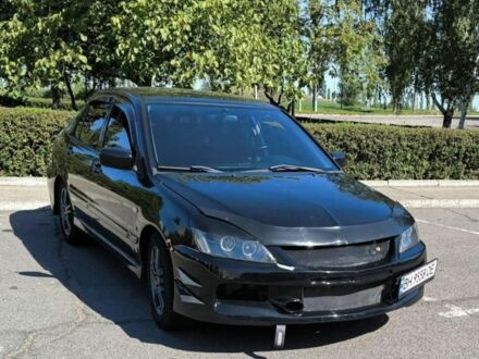 Черный Мицубиси Лансер, объемом двигателя 2 л и пробегом 161 тыс. км за 4500 $, фото 1 на Automoto.ua