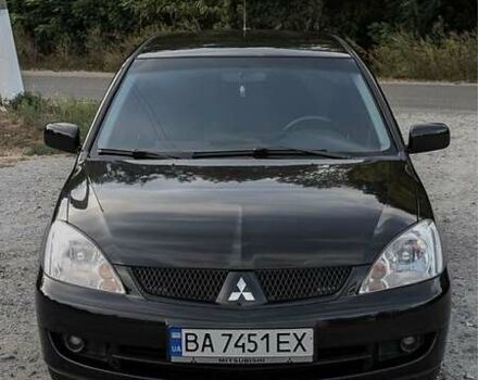 Черный Мицубиси Лансер, объемом двигателя 1.6 л и пробегом 226 тыс. км за 4800 $, фото 1 на Automoto.ua