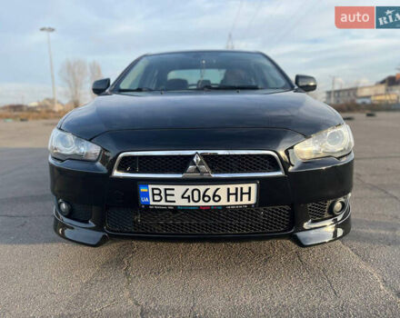 Черный Мицубиси Лансер, объемом двигателя 2 л и пробегом 193 тыс. км за 7500 $, фото 1 на Automoto.ua