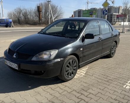 Черный Мицубиси Лансер, объемом двигателя 1.6 л и пробегом 300 тыс. км за 2999 $, фото 1 на Automoto.ua