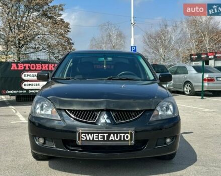 Черный Мицубиси Лансер, объемом двигателя 1.6 л и пробегом 226 тыс. км за 3899 $, фото 1 на Automoto.ua