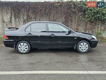 Чорний Міцубісі Lancer, об'ємом двигуна 1.6 л та пробігом 152 тис. км за 4999 $, фото 1 на Automoto.ua