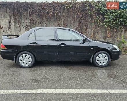 Черный Мицубиси Лансер, объемом двигателя 1.6 л и пробегом 152 тыс. км за 4999 $, фото 1 на Automoto.ua