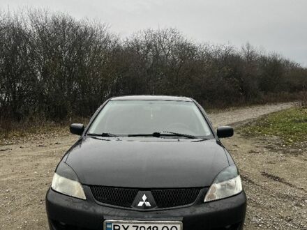 Черный Мицубиси Лансер, объемом двигателя 1.6 л и пробегом 272 тыс. км за 2800 $, фото 1 на Automoto.ua