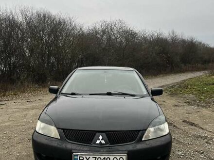 Черный Мицубиси Лансер, объемом двигателя 1.6 л и пробегом 272 тыс. км за 2800 $, фото 1 на Automoto.ua