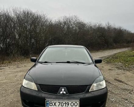 Черный Мицубиси Лансер, объемом двигателя 1.6 л и пробегом 272 тыс. км за 2800 $, фото 1 на Automoto.ua