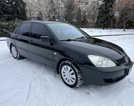 Черный Мицубиси Лансер, объемом двигателя 1.6 л и пробегом 260 тыс. км за 3999 $, фото 1 на Automoto.ua