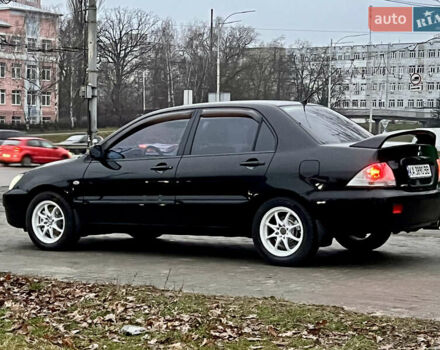 Чорний Міцубісі Lancer, об'ємом двигуна 1.6 л та пробігом 303 тис. км за 4350 $, фото 1 на Automoto.ua
