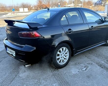 Черный Мицубиси Лансер, объемом двигателя 2 л и пробегом 24500 тыс. км за 5000 $, фото 1 на Automoto.ua