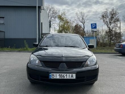 Черный Мицубиси Лансер, объемом двигателя 1.6 л и пробегом 250 тыс. км за 4800 $, фото 1 на Automoto.ua