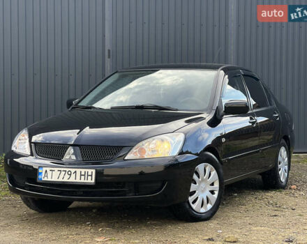 Чорний Міцубісі Lancer, об'ємом двигуна 1.58 л та пробігом 185 тис. км за 3750 $, фото 1 на Automoto.ua