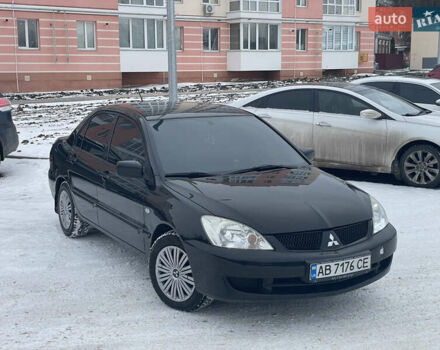 Чорний Міцубісі Lancer, об'ємом двигуна 1.58 л та пробігом 199 тис. км за 4400 $, фото 1 на Automoto.ua