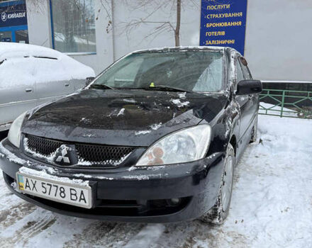 Черный Мицубиси Лансер, объемом двигателя 1.58 л и пробегом 265 тыс. км за 3550 $, фото 1 на Automoto.ua