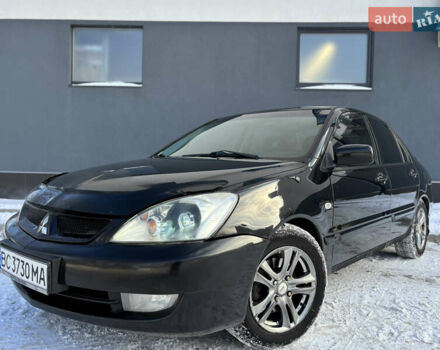 Черный Мицубиси Лансер, объемом двигателя 1.6 л и пробегом 145 тыс. км за 4200 $, фото 1 на Automoto.ua