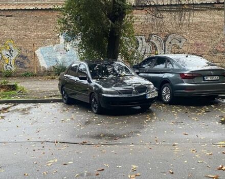 Черный Мицубиси Лансер, объемом двигателя 1.6 л и пробегом 253 тыс. км за 4700 $, фото 1 на Automoto.ua