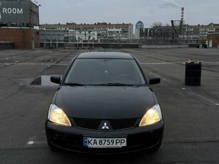 Черный Мицубиси Лансер, объемом двигателя 1.58 л и пробегом 260 тыс. км за 3299 $, фото 1 на Automoto.ua