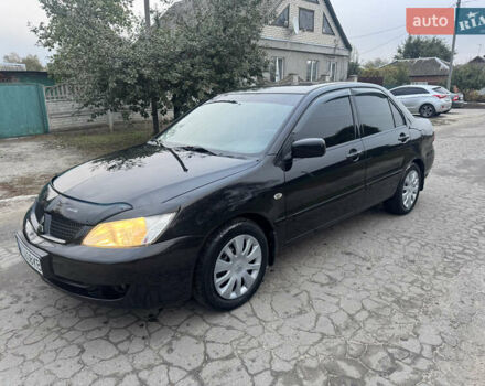 Чорний Міцубісі Lancer, об'ємом двигуна 1.58 л та пробігом 240 тис. км за 5000 $, фото 1 на Automoto.ua