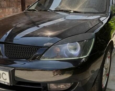 Чорний Міцубісі Lancer, об'ємом двигуна 1.6 л та пробігом 240 тис. км за 4004 $, фото 1 на Automoto.ua