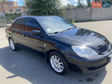 Черный Мицубиси Лансер, объемом двигателя 1.6 л и пробегом 215 тыс. км за 3900 $, фото 1 на Automoto.ua