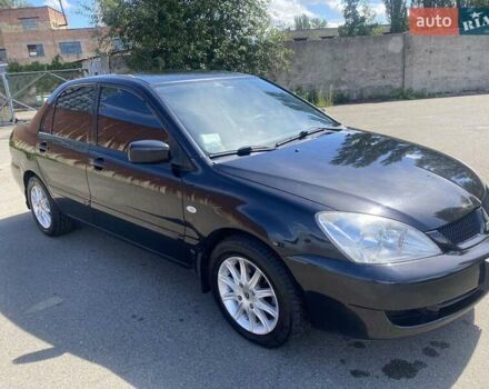 Черный Мицубиси Лансер, объемом двигателя 1.6 л и пробегом 215 тыс. км за 3900 $, фото 1 на Automoto.ua