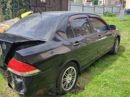 Чорний Міцубісі Lancer, об'ємом двигуна 1.6 л та пробігом 22 тис. км за 1700 $, фото 1 на Automoto.ua