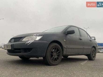 Чорний Міцубісі Lancer, об'ємом двигуна 1.58 л та пробігом 263 тис. км за 4000 $, фото 1 на Automoto.ua