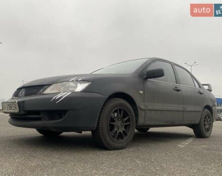 Черный Мицубиси Лансер, объемом двигателя 1.58 л и пробегом 263 тыс. км за 4000 $, фото 1 на Automoto.ua