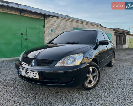 Черный Мицубиси Лансер, объемом двигателя 1.58 л и пробегом 156 тыс. км за 4599 $, фото 1 на Automoto.ua