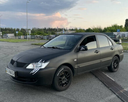 Чорний Міцубісі Lancer, об'ємом двигуна 1.6 л та пробігом 259 тис. км за 4500 $, фото 1 на Automoto.ua