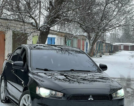 Чорний Міцубісі Lancer, об'ємом двигуна 2 л та пробігом 182 тис. км за 6999 $, фото 1 на Automoto.ua