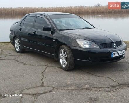 Чорний Міцубісі Lancer, об'ємом двигуна 2 л та пробігом 286 тис. км за 4000 $, фото 1 на Automoto.ua