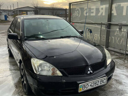 Черный Мицубиси Лансер, объемом двигателя 1.6 л и пробегом 180 тыс. км за 3499 $, фото 1 на Automoto.ua