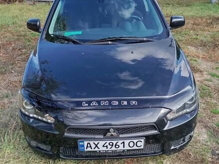 Черный Мицубиси Лансер, объемом двигателя 2 л и пробегом 200 тыс. км за 5900 $, фото 1 на Automoto.ua