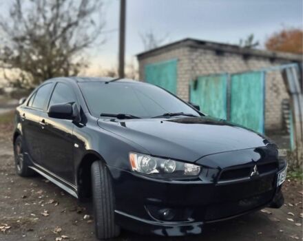 Черный Мицубиси Лансер, объемом двигателя 2 л и пробегом 170 тыс. км за 7000 $, фото 1 на Automoto.ua