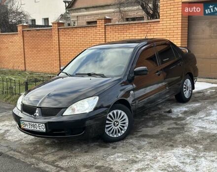 Чорний Міцубісі Lancer, об'ємом двигуна 1.58 л та пробігом 176 тис. км за 4500 $, фото 1 на Automoto.ua