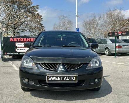 Черный Мицубиси Лансер, объемом двигателя 1.6 л и пробегом 226 тыс. км за 3899 $, фото 1 на Automoto.ua