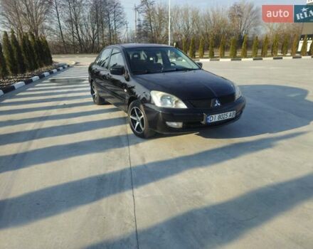 Чорний Міцубісі Lancer, об'ємом двигуна 1.59 л та пробігом 180 тис. км за 4999 $, фото 1 на Automoto.ua