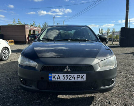 Черный Мицубиси Лансер, объемом двигателя 2 л и пробегом 292 тыс. км за 4200 $, фото 1 на Automoto.ua
