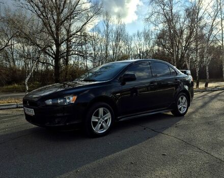 Черный Мицубиси Лансер, объемом двигателя 2 л и пробегом 224 тыс. км за 7000 $, фото 1 на Automoto.ua