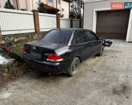 Черный Мицубиси Лансер, объемом двигателя 1.58 л и пробегом 160 тыс. км за 1299 $, фото 1 на Automoto.ua